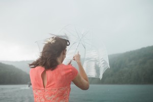 maid of honor in rain storm on pontoon boat photograph
