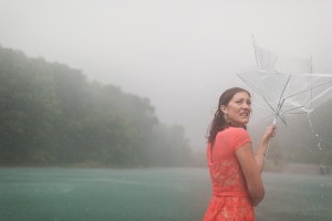 maid of honor in rain storm on pontoon boat photograph