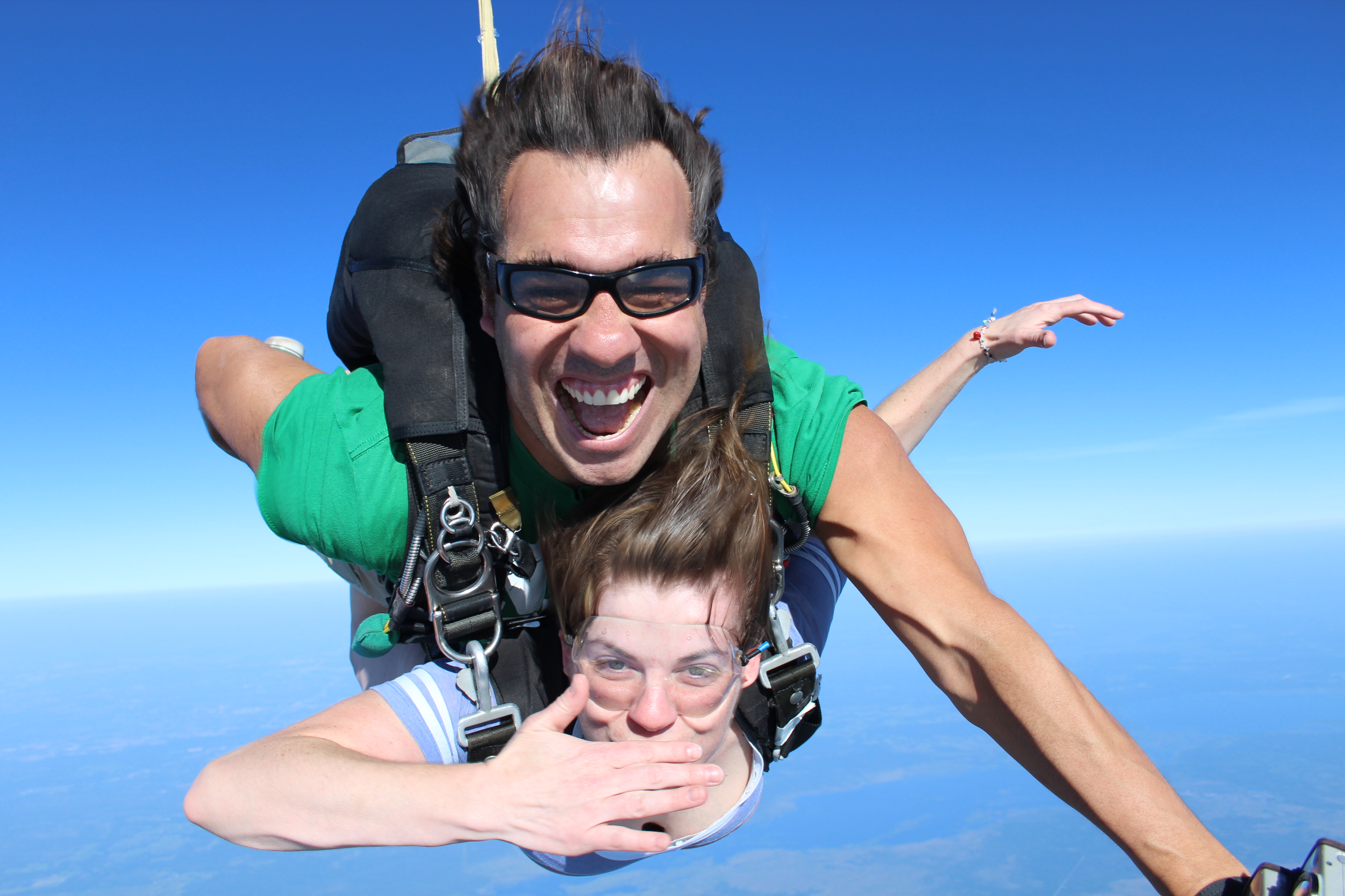 sky diving and blowing a kiss adventure photography