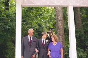 bride with parents walks down aisle outdoor frederick wedding photography