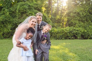 happy family at shade trees and evergreens wedding photograph