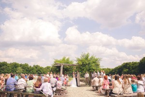 sunny summer wedding ceremony with blue skies photograph