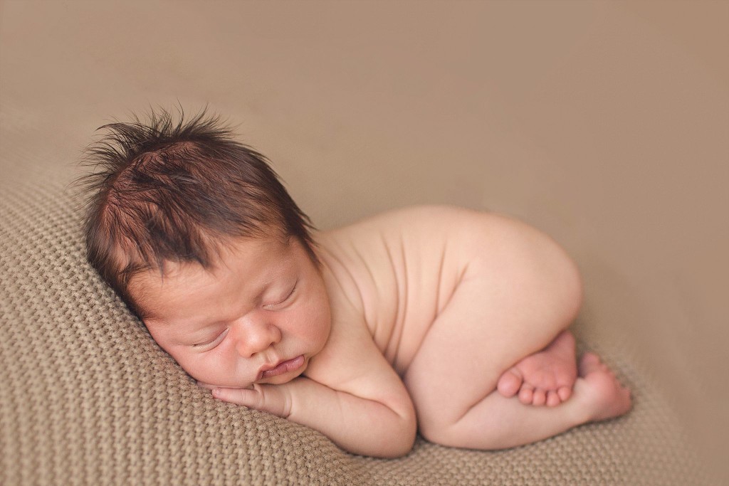 frederick and baltimore newborn photographer captures posed sleeping baby