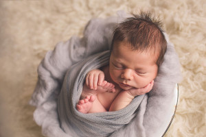 posed baby in bowl frederick newborn photographer