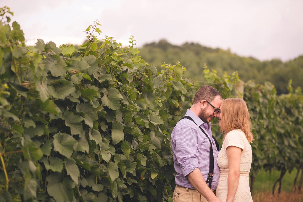 couple in love snuggle in vineyard after dc wedding for portrait photography