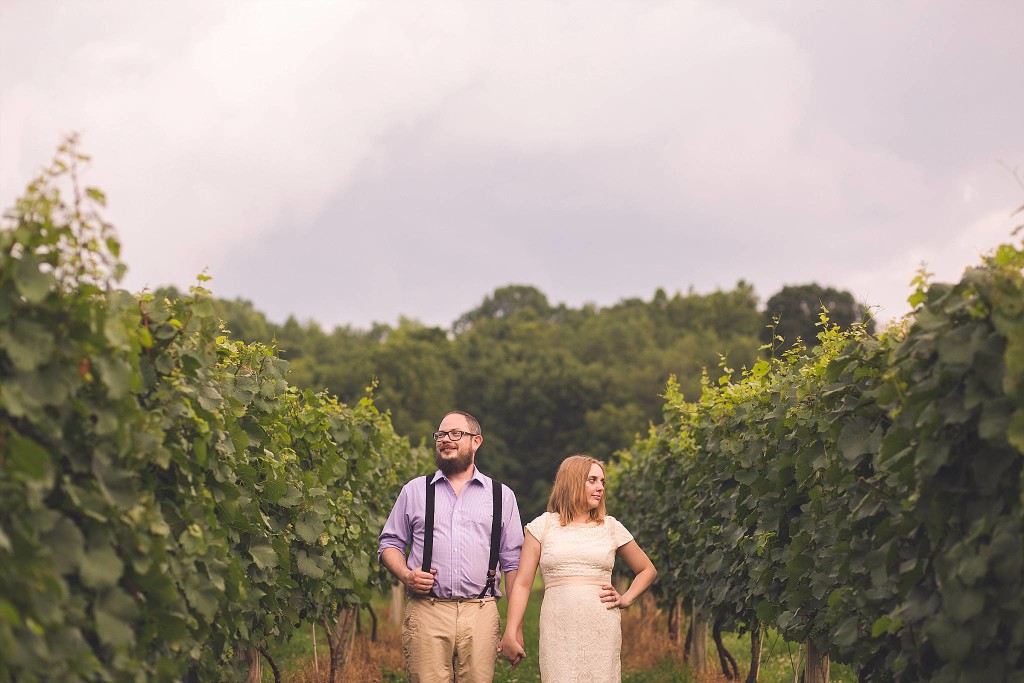 hipser couple pose in vineyard after outdoor wedding in dc for photography