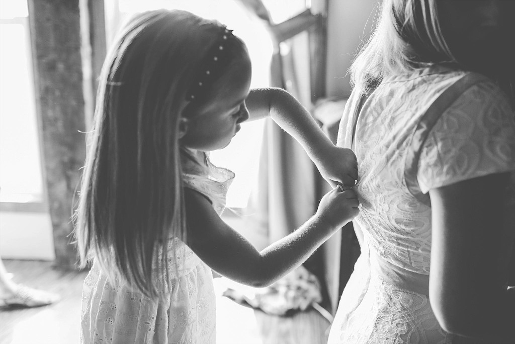 flower girl helps bride get ready at dc wedding photograph
