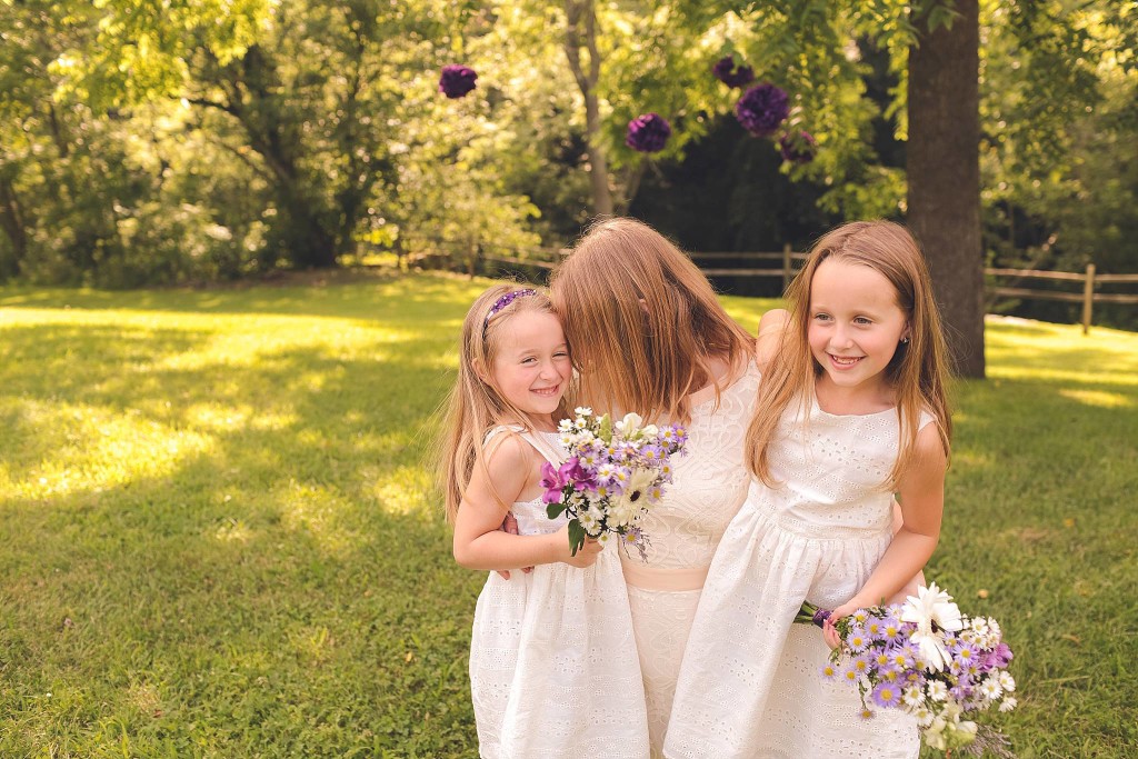 jacqie q photography captures bride with daughters after outdoor dc wedding