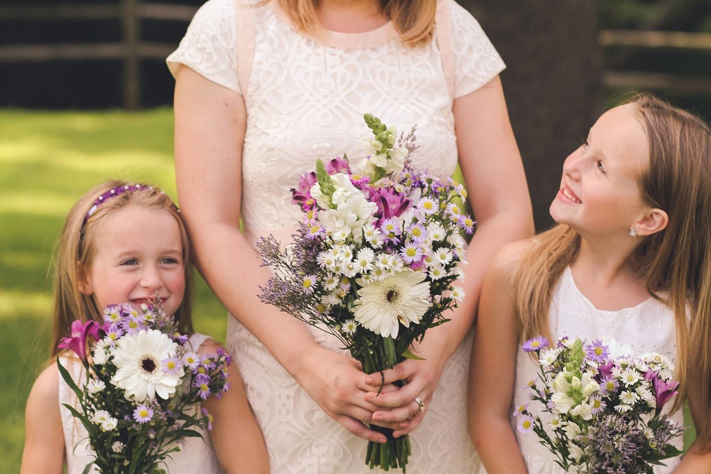 bride and daughters smile after dc outdoor wedding