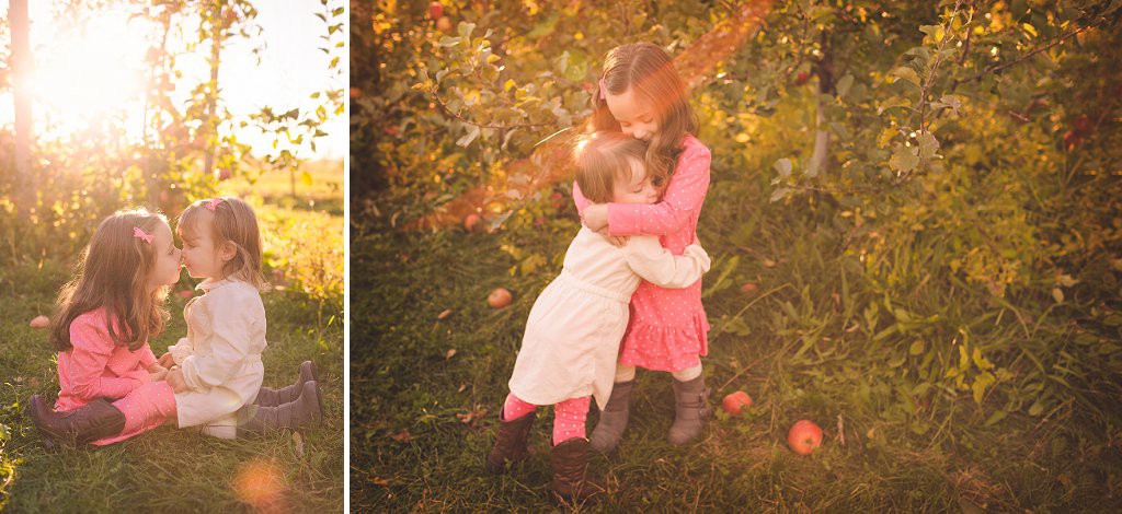 sister love in apple orchard by jacqie q photography in frederick