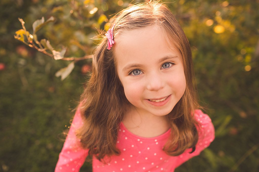 happy girl in apple orchard maryland photography