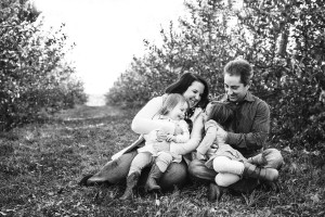 family laughing in apple orchard at gaver farm