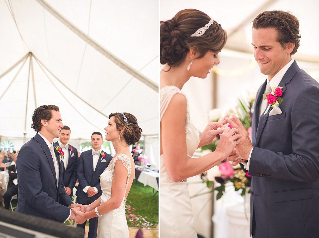 bride and groom exchange rings under tent in baltimore
