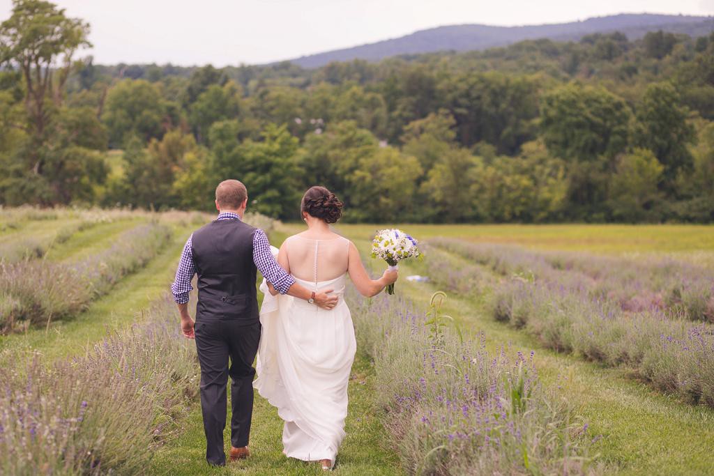 Washington DC Wedding Photographer captures groom holding dress