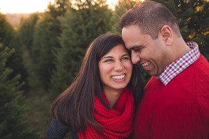 pregnant couple laughing during frederick maternity photography session
