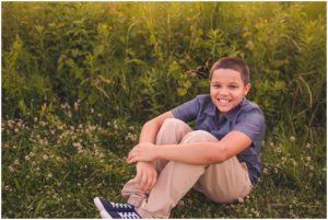boy in field during baltimore family photography session