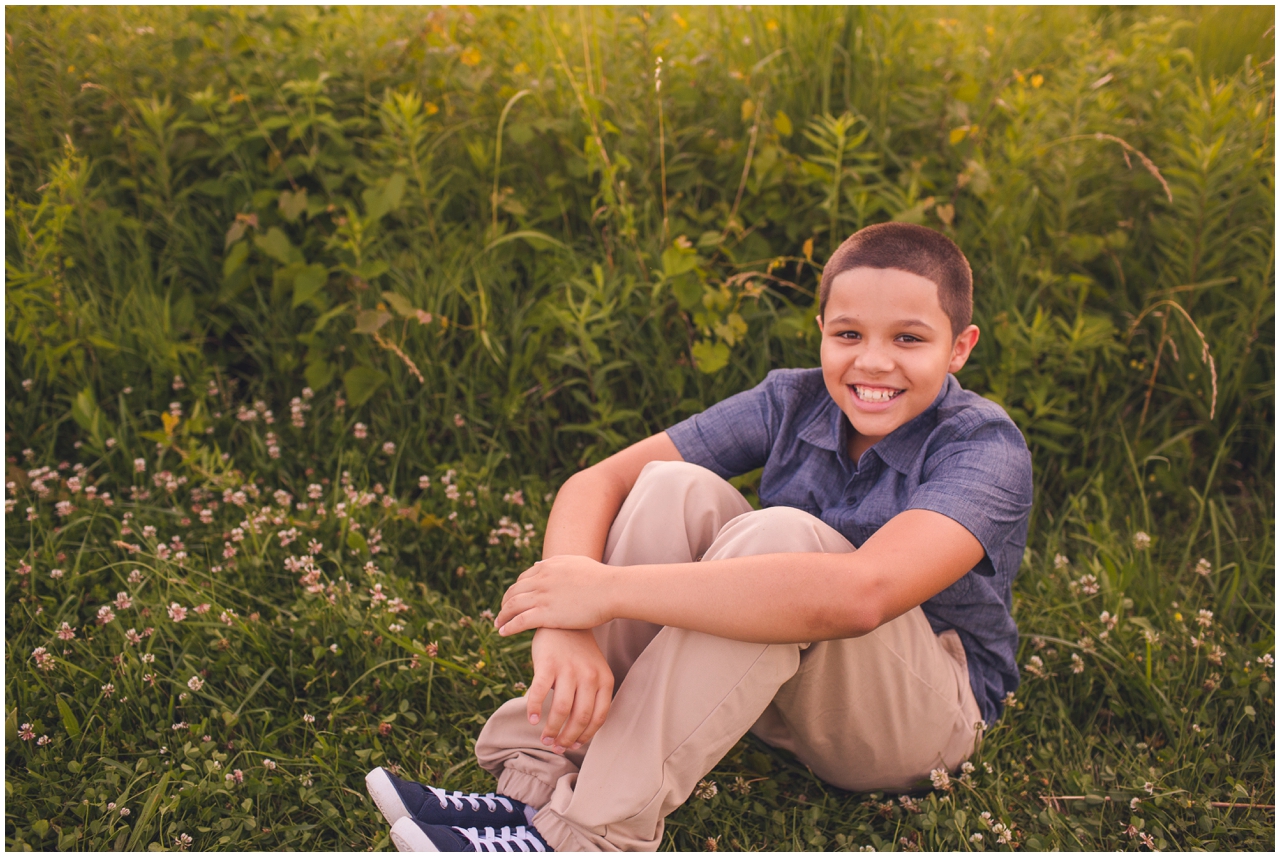 boy in field during baltimore family photography session