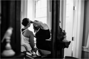 bride gets make up on at springfield manor wedding