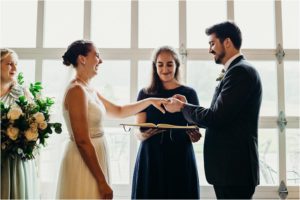 bride and groom exchange rings at springfield manor wedding