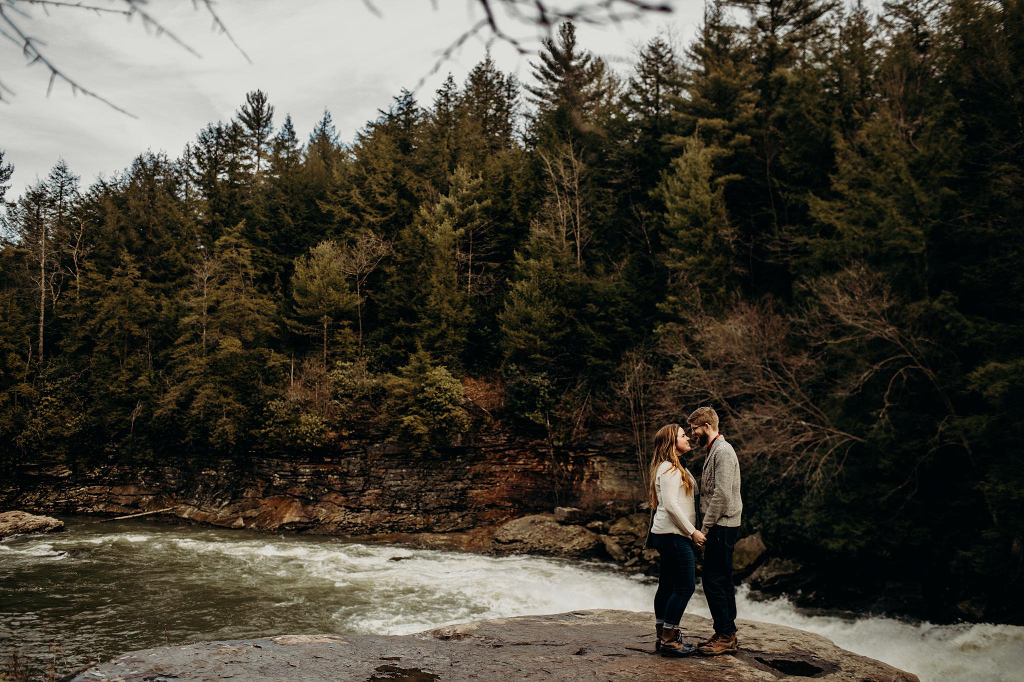 swallow falls engagement photography with couple on falls